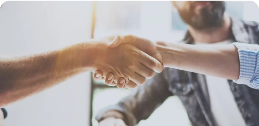 Business partnership handshake