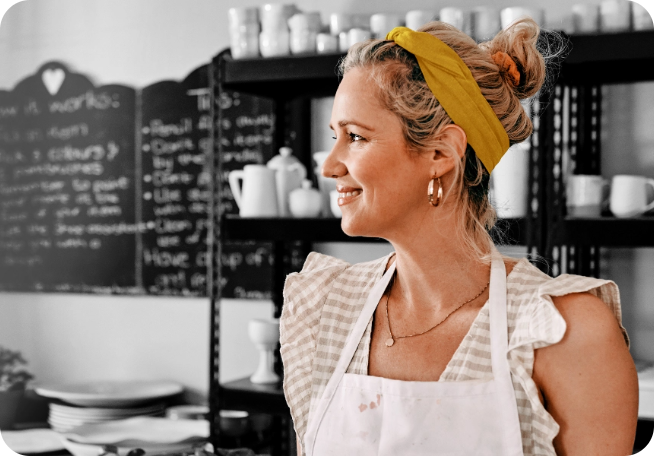 Female café owner with a yellow headband